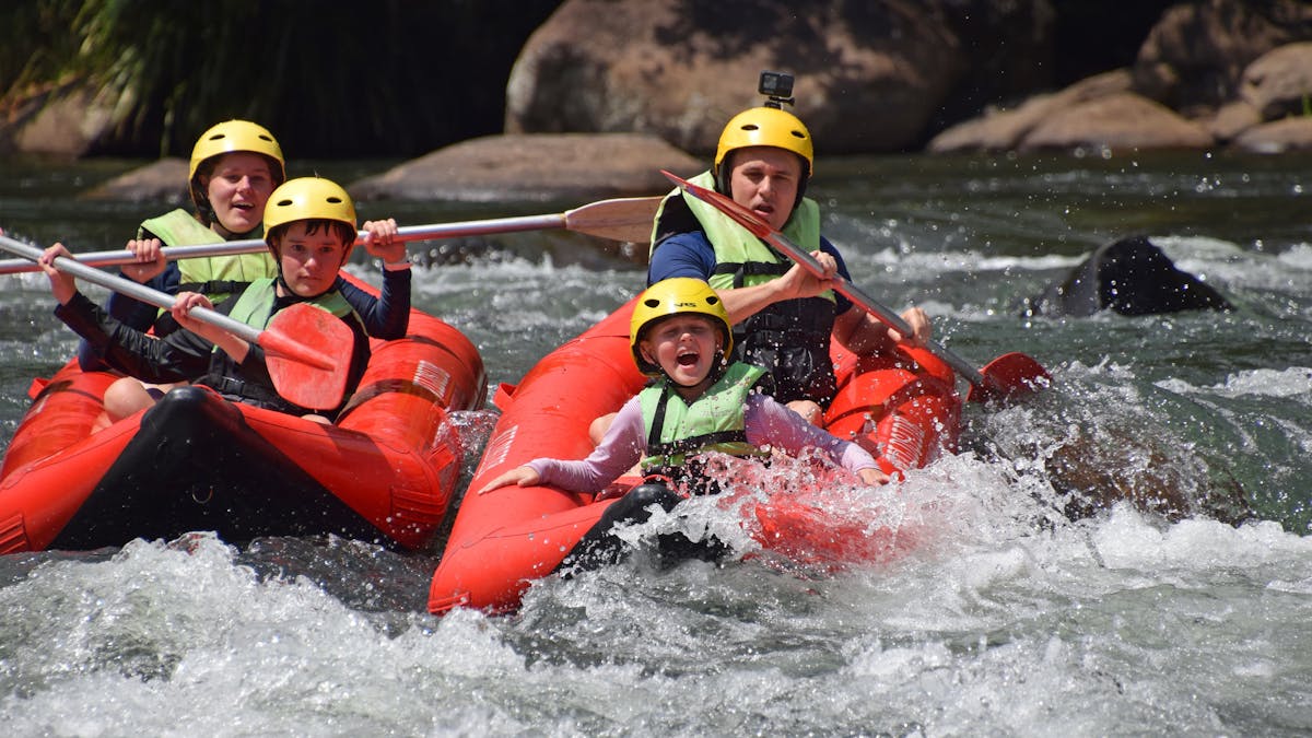 Family of four in two sports rafts