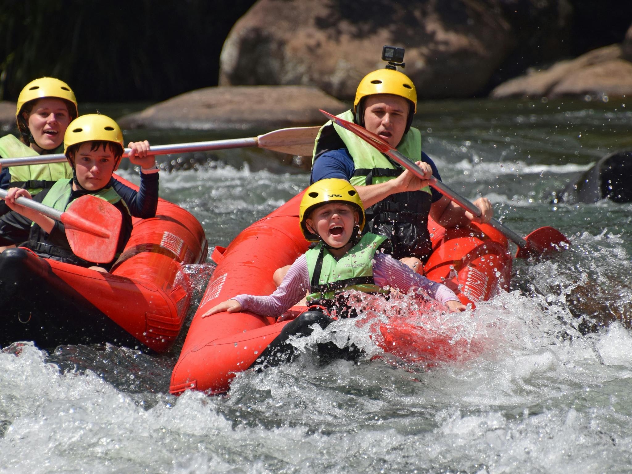 Family of four in two sports rafts