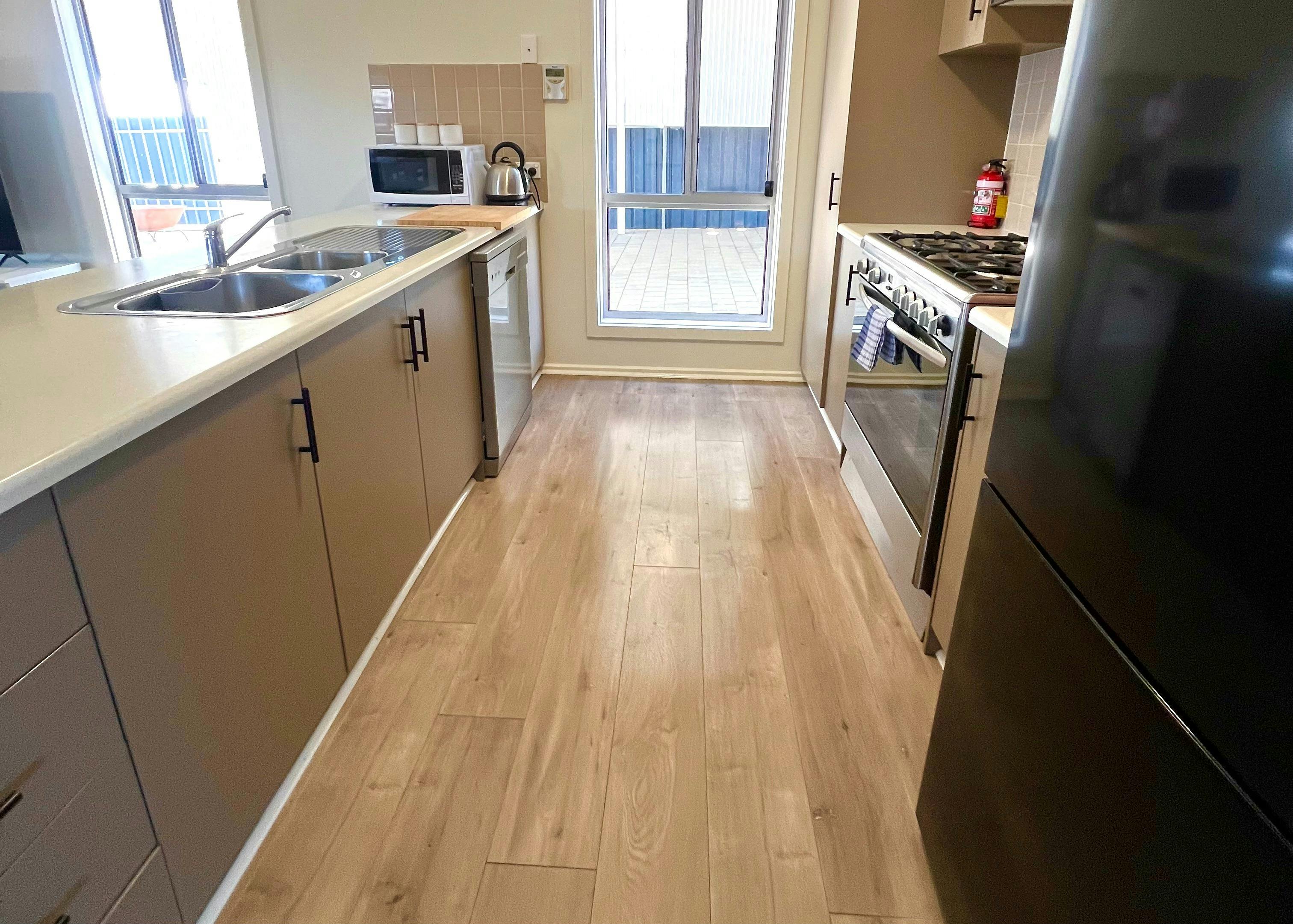 The full-sized kitchen includes modern appliances