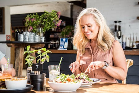 Woman enjoying a meal at The Ten Mile in Holbrook