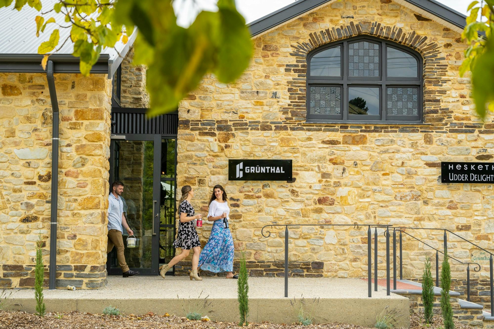 People walking out of Grunthal Brew Building
