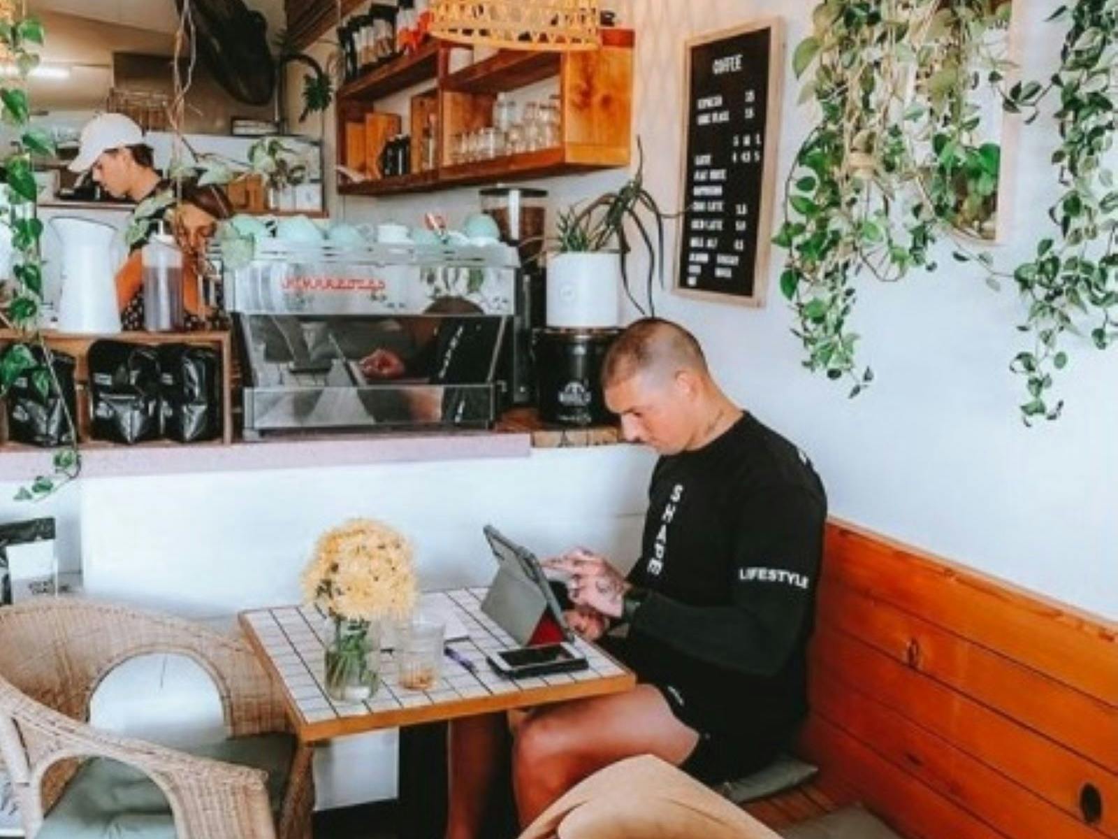 Man inside cafe on laptop