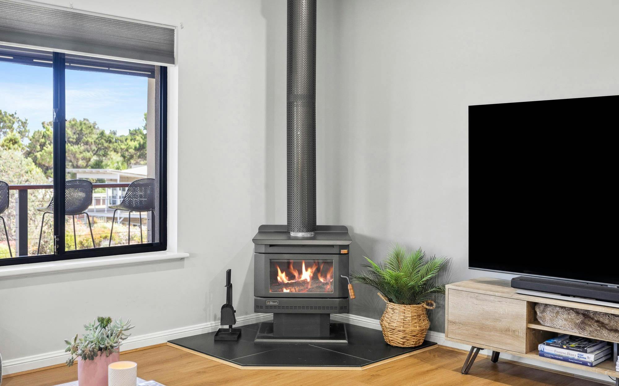 Lifes Better Beachside - lounge fireplace