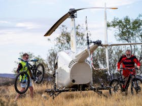 Riders unloading bikes from helicopter