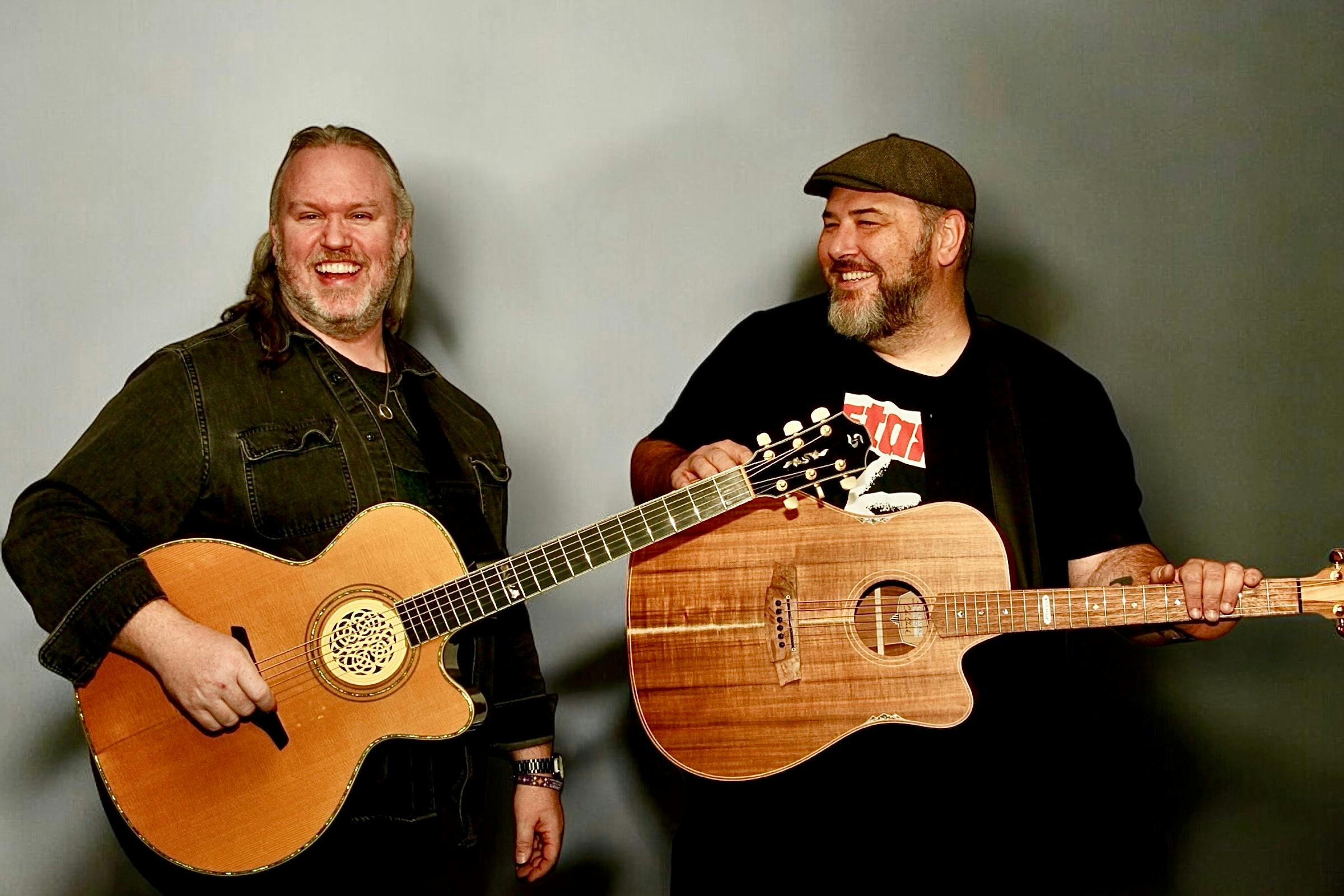 Charlie A'Court & Lloyd Spiegel with their acoustic guitars