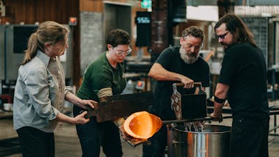 Four artists cooling the pipes in the Glassowrks Hotshop