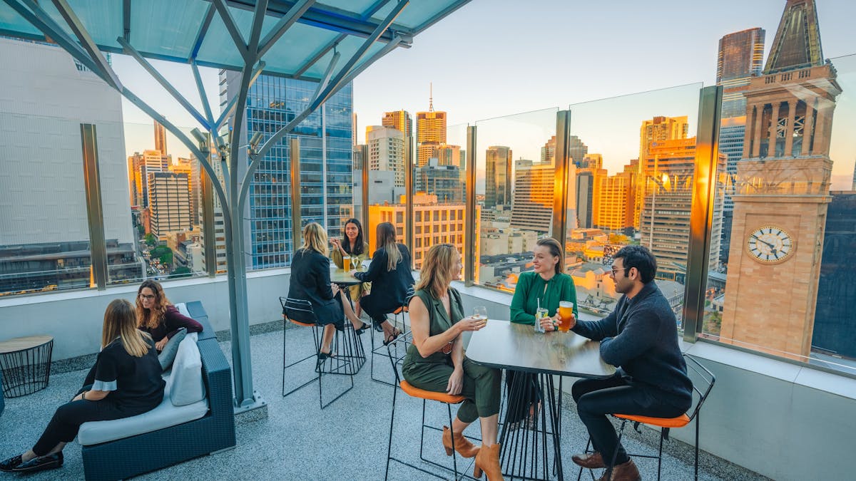 Sixteen Antlers Rooftop Bar, cocktails and sunset overlooking the city skyline
