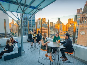 Sixteen Antlers Rooftop Bar, cocktails and sunset overlooking the city skyline