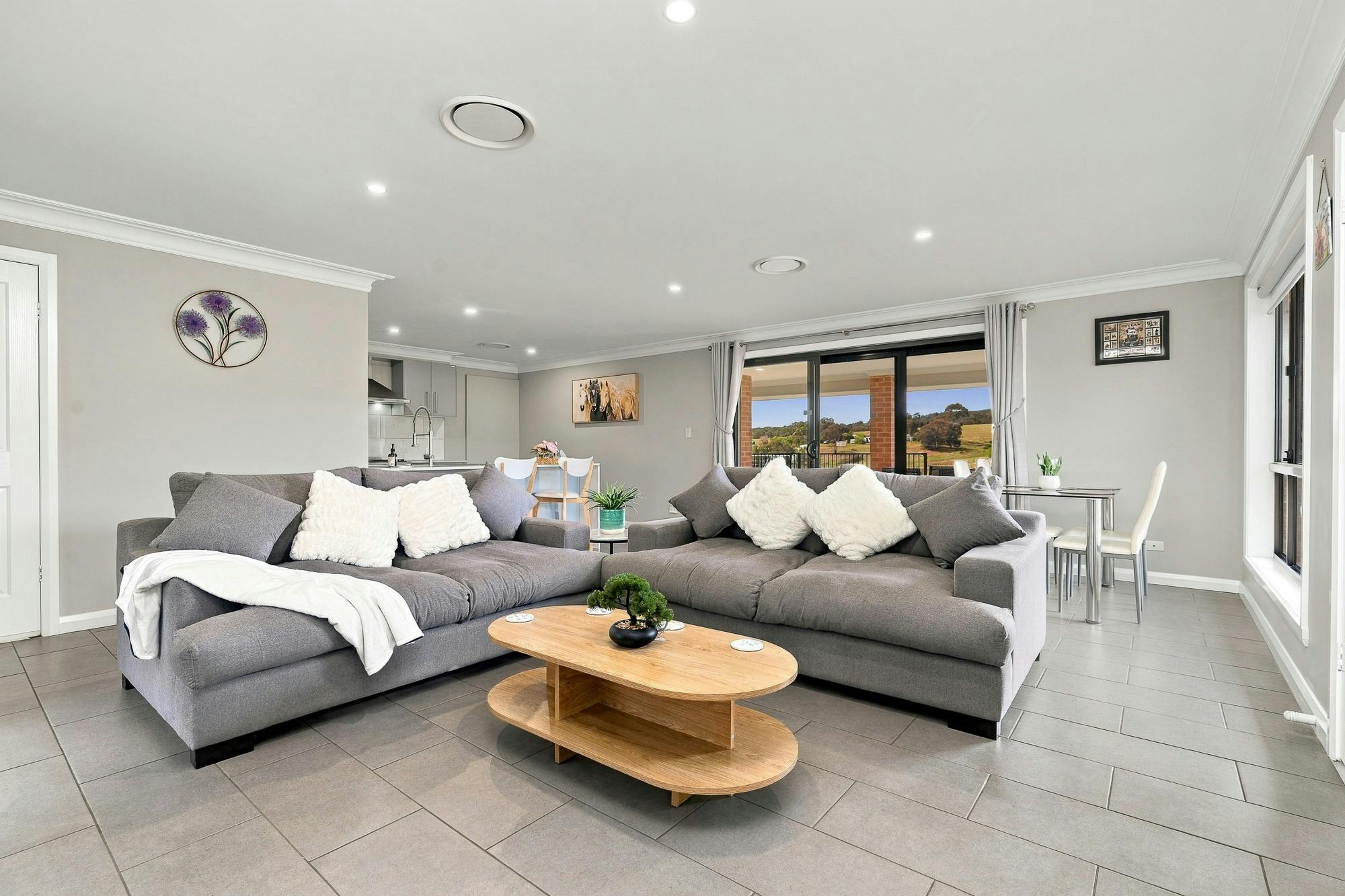 Lounge room with 2 large grey couches