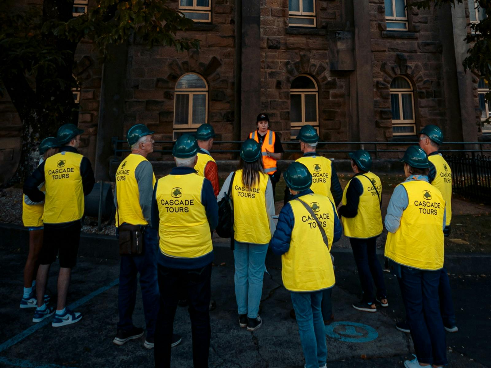 Tour Guide speaking to group outside the Cascade Brewery