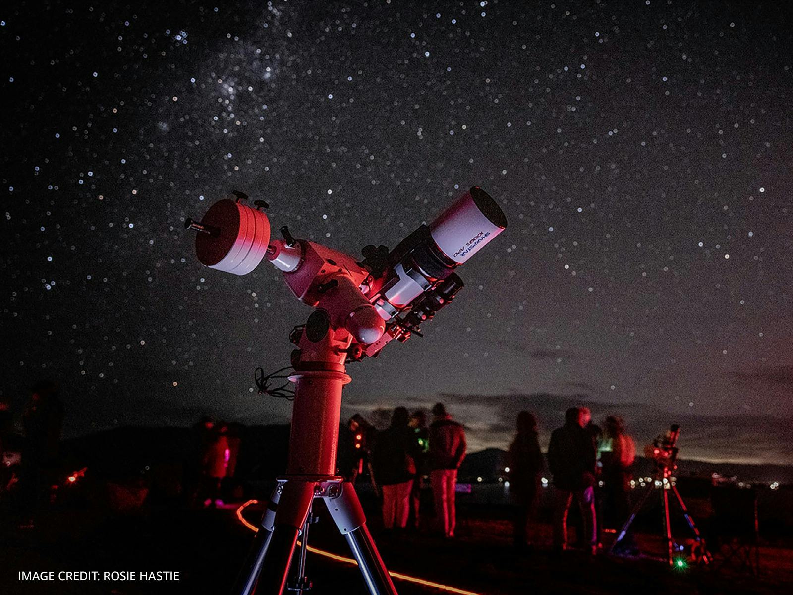 An image of a telescope and the night sky