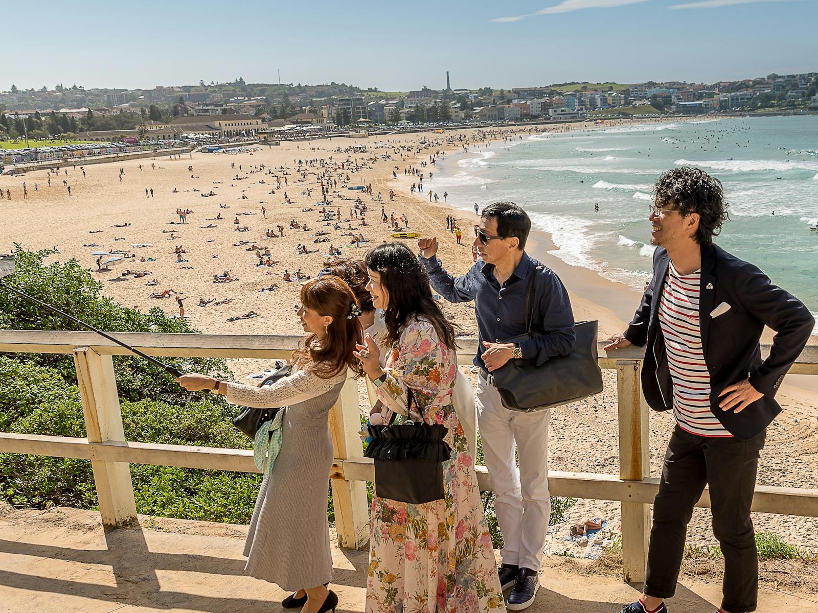 Corporate team on a walkway above Bondi beach