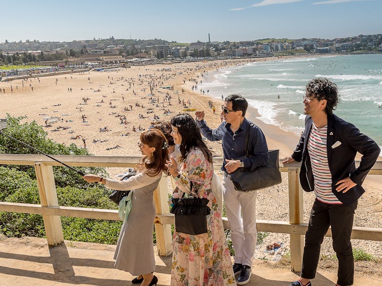 Corporate team on a walkway above Bondi beach