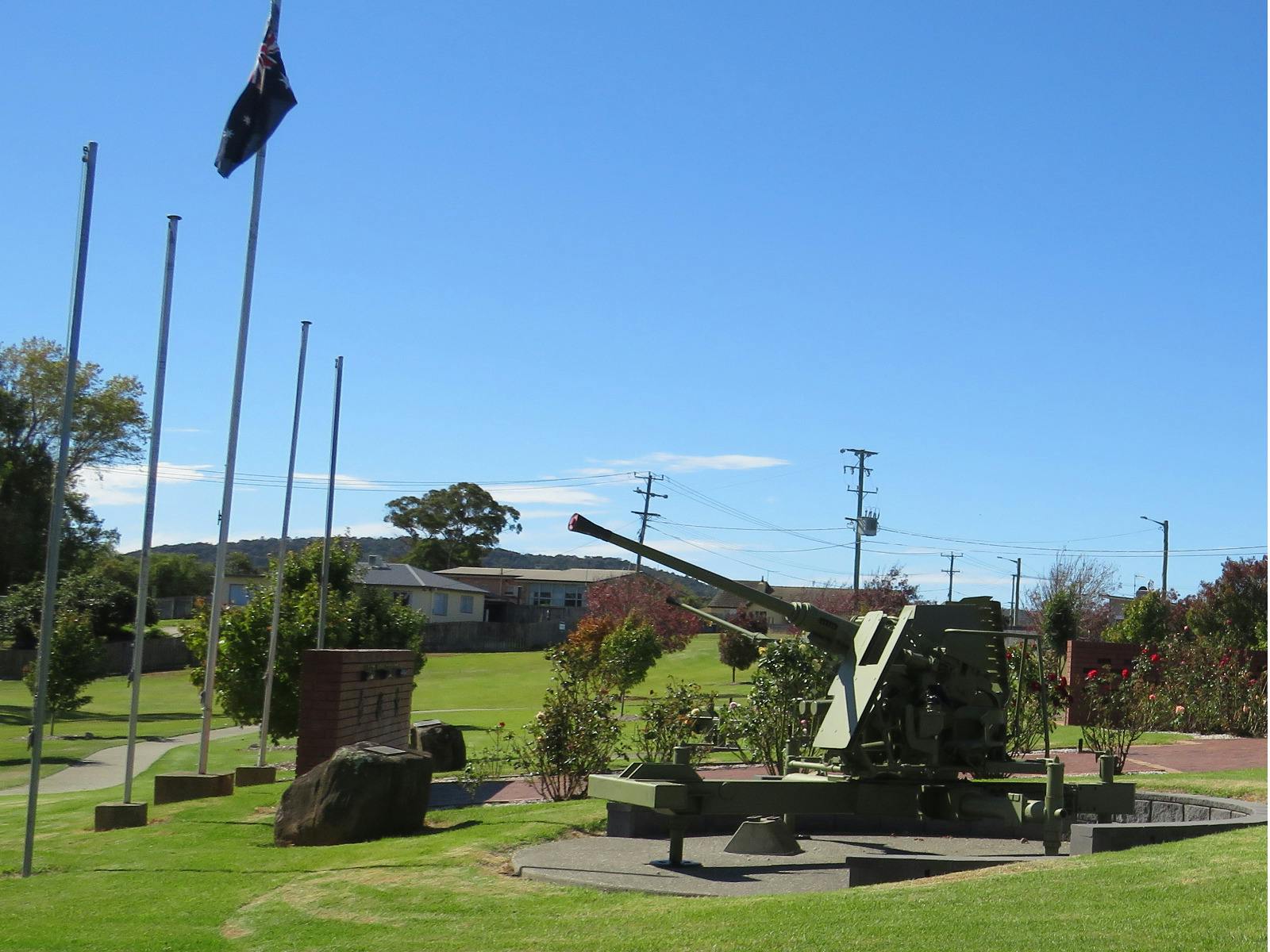 The Australian flag flys above one othe Bofors guns