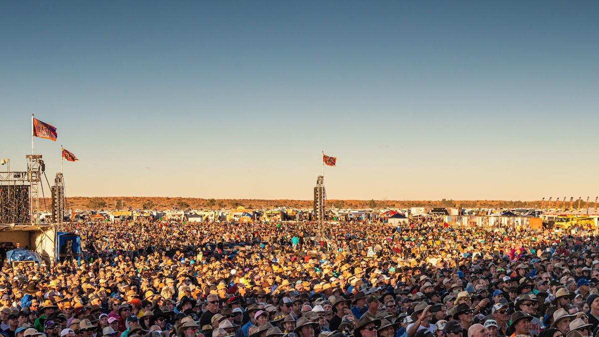 Festival crowd dancing at the Big Red Bash concert stage, Simpson Desert Queensland