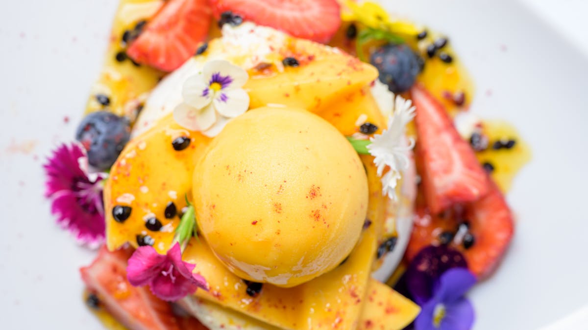 Summer mango pavlova
