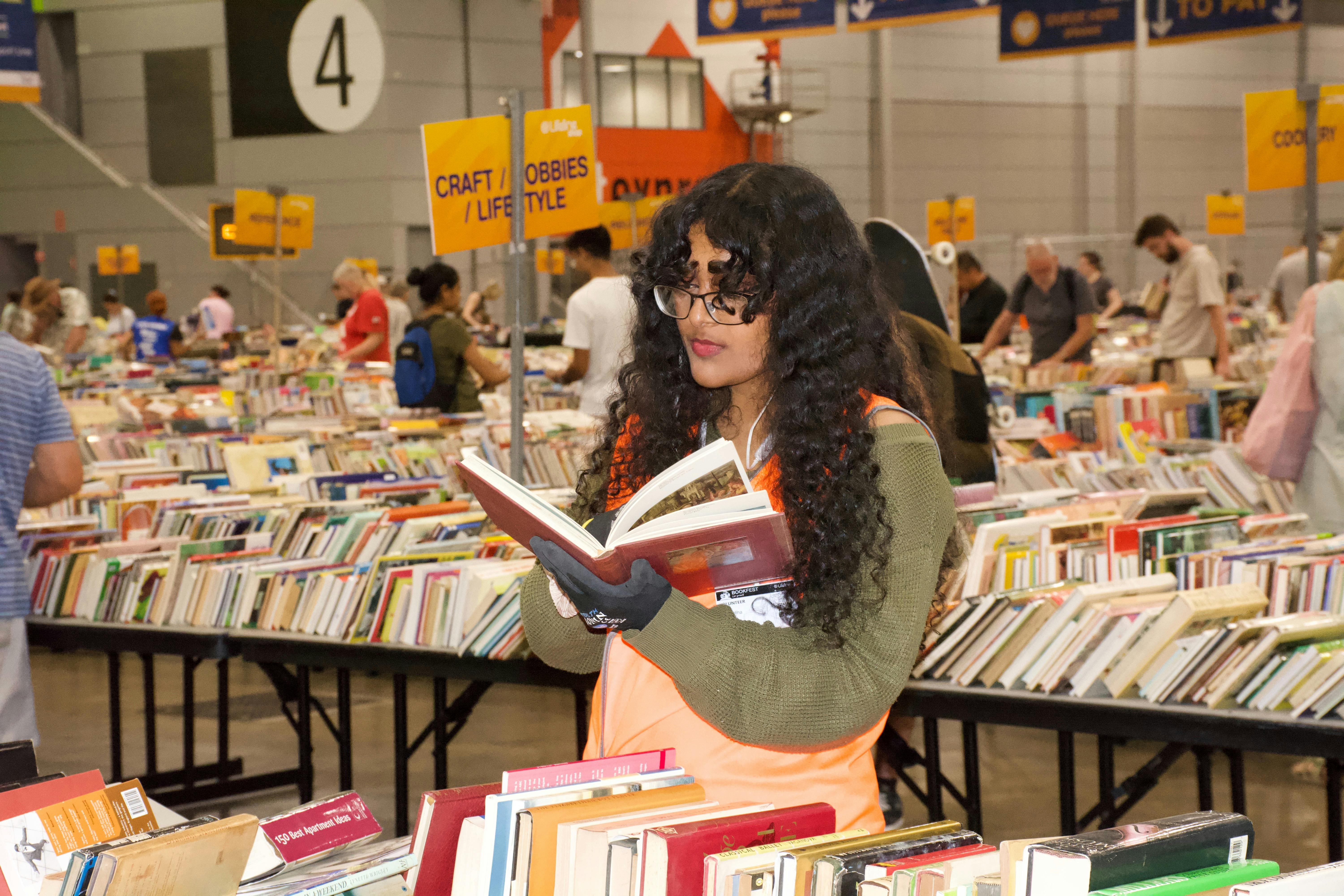 A volunteer reading a book