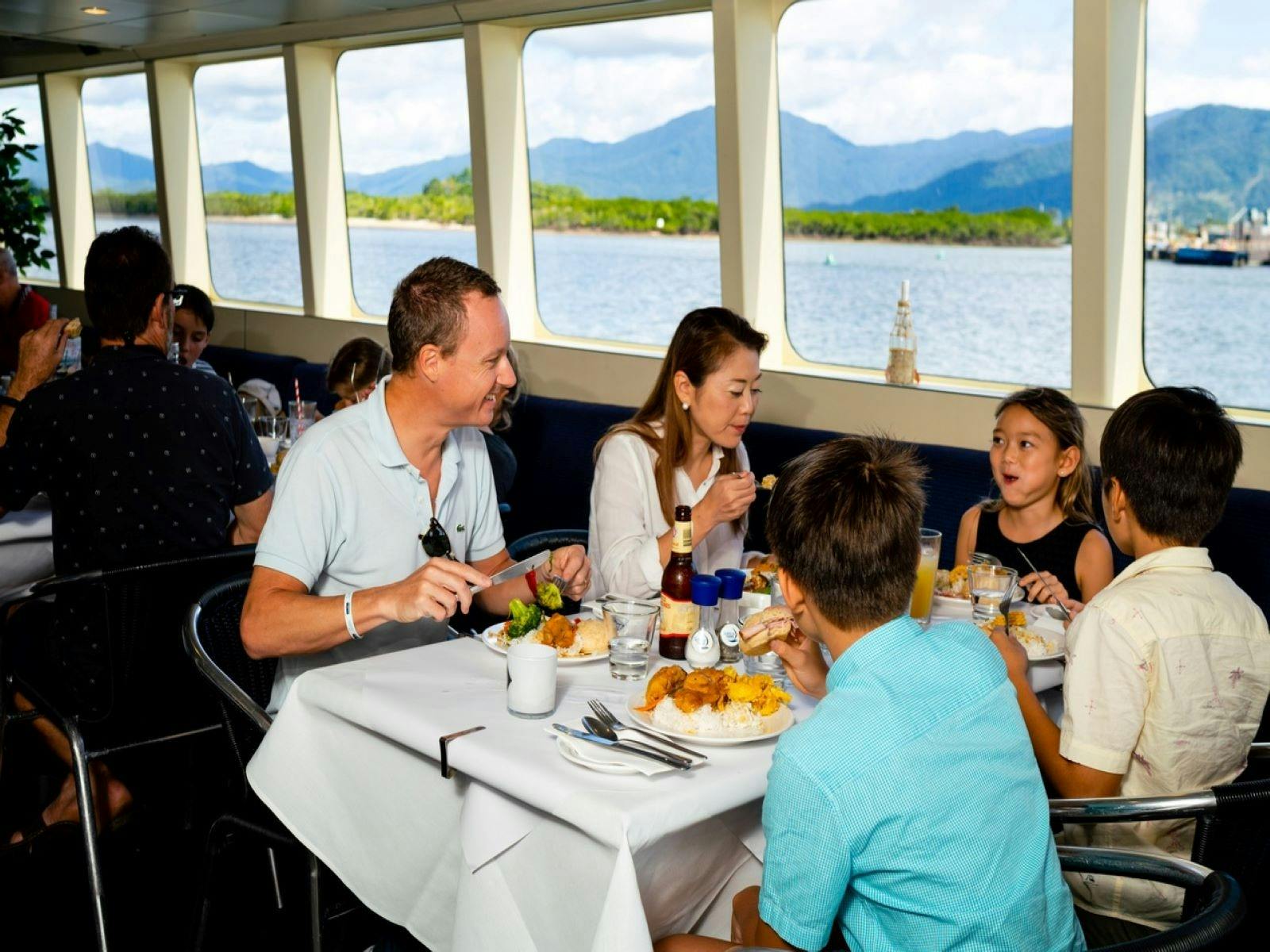 Family of 4 enjoying buffet during cruise