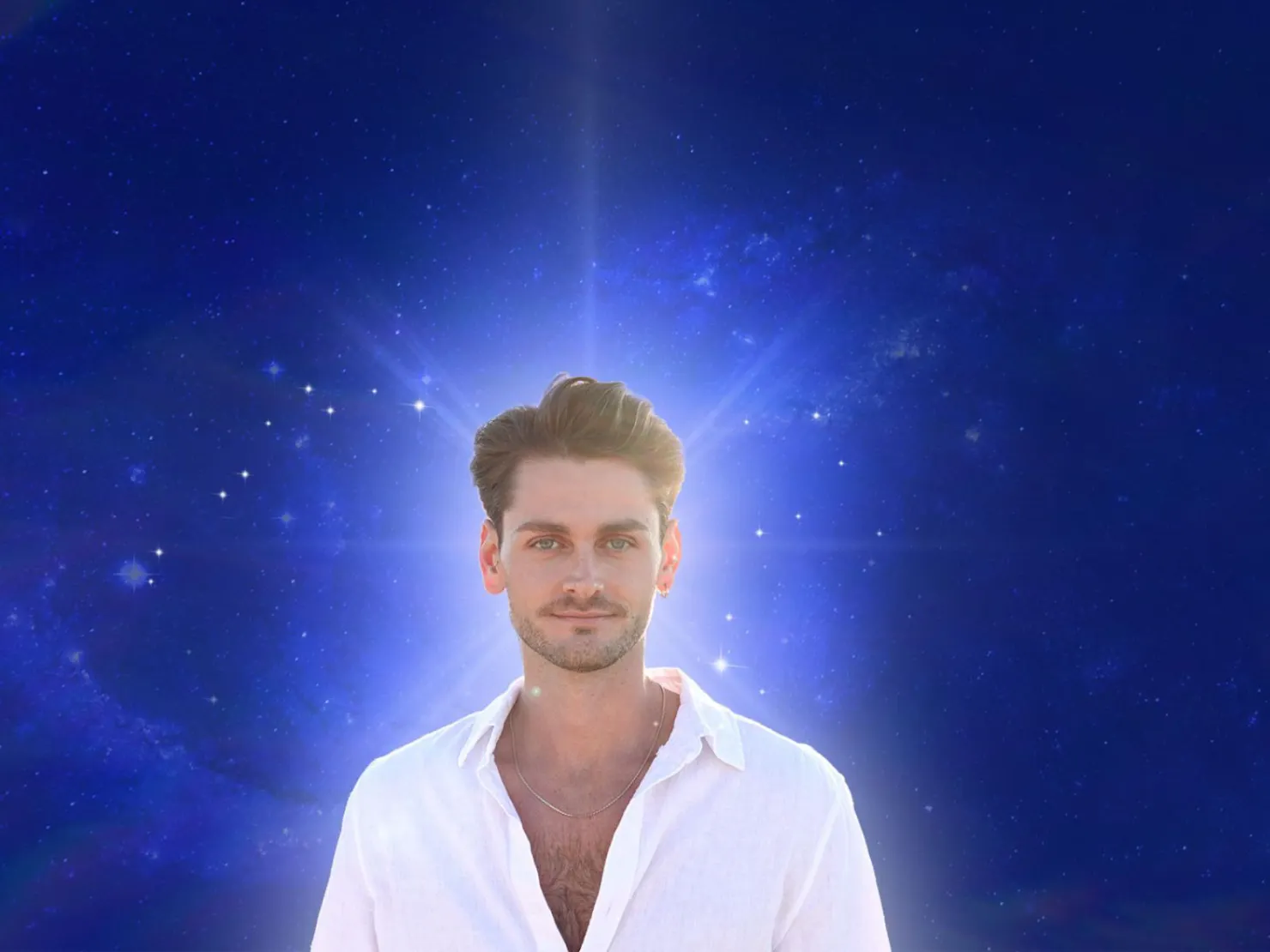 man in white shirt with blue background and white light behind him