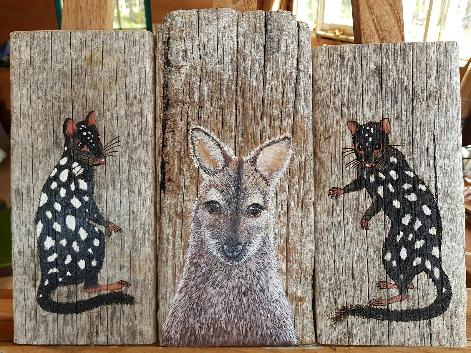 eastern quolls and bennetts wallaby painted on wood