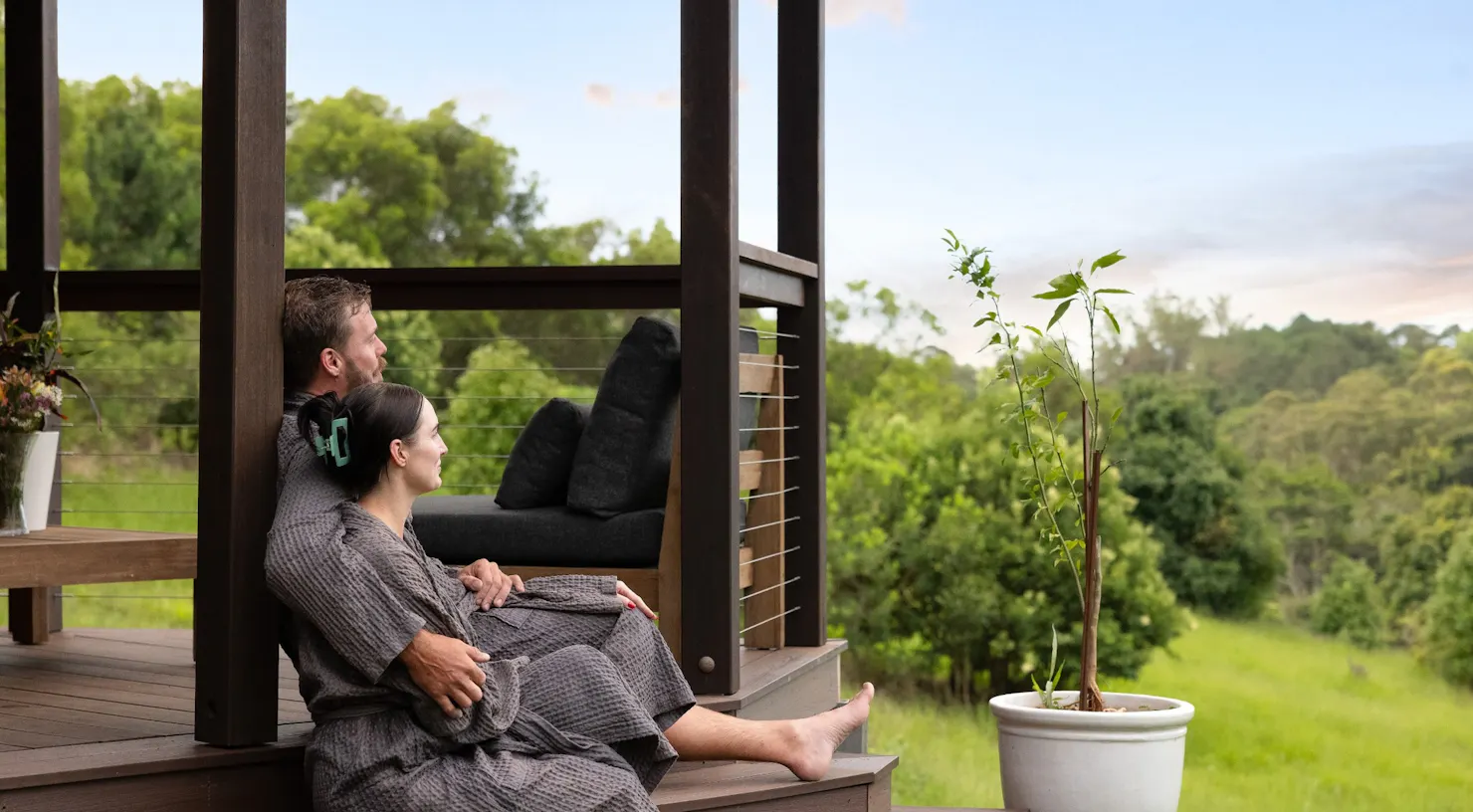 Couple relaxing on outdoor deck at The Range Holistic Spa and Wellness, Montville hinterland