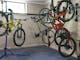 Room to store bikes along wall and a bike stand for repairs
