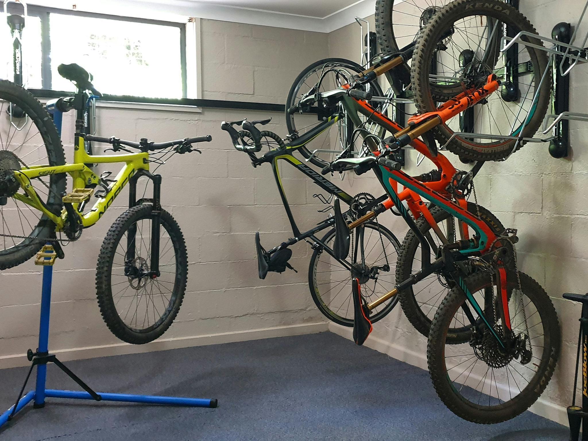 Room to store bikes along wall and a bike stand for repairs