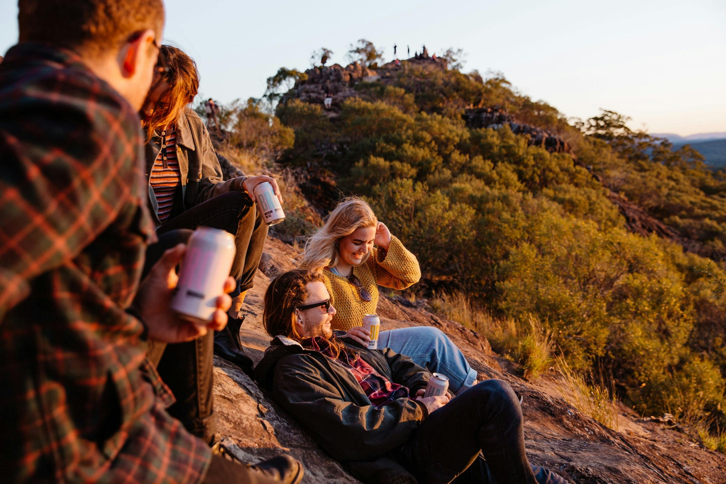People enjoying Brouhaha craft beer cans in the Sunshine Coast Hinterland