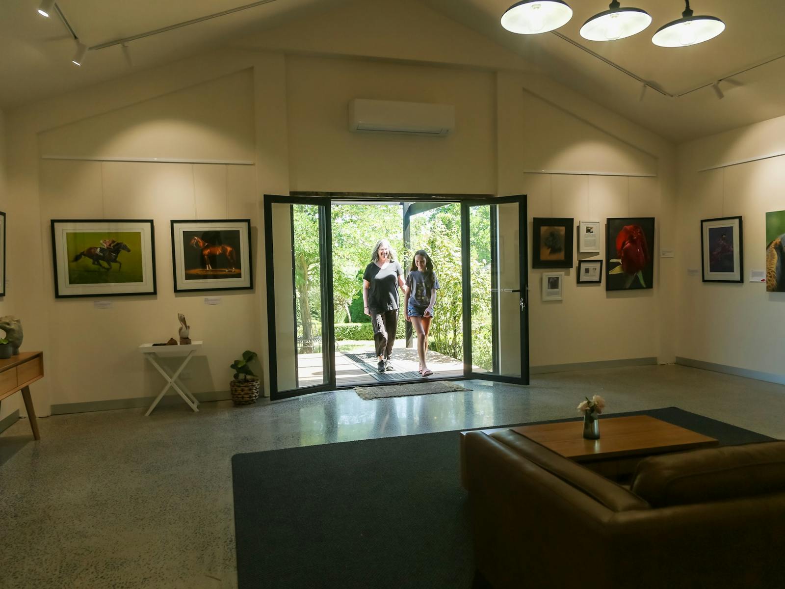 visitors walking into the gallery at High Country Gardens Gallery and Maze