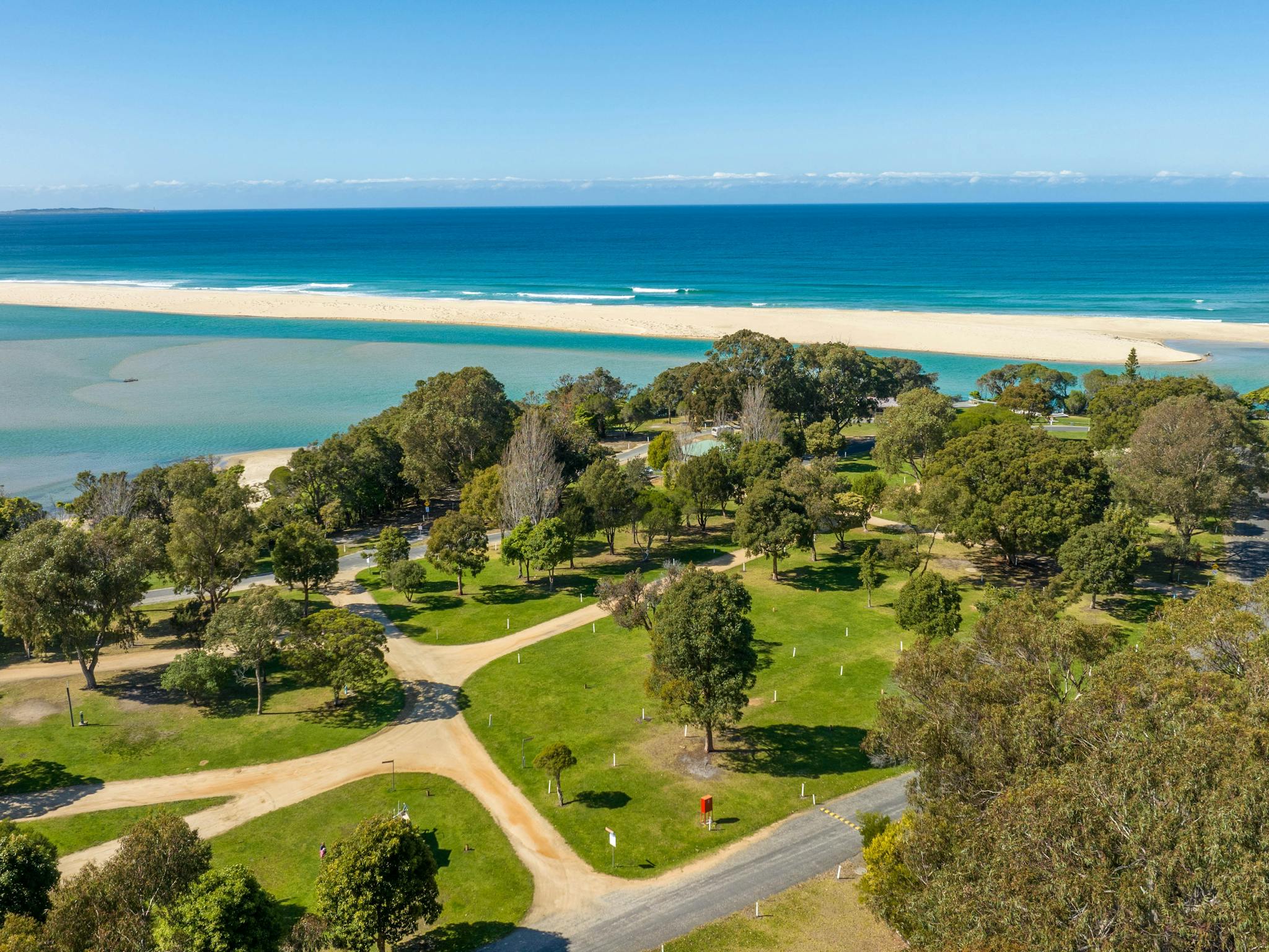Aerial view of campsites showing connecting roads and surrounding trees