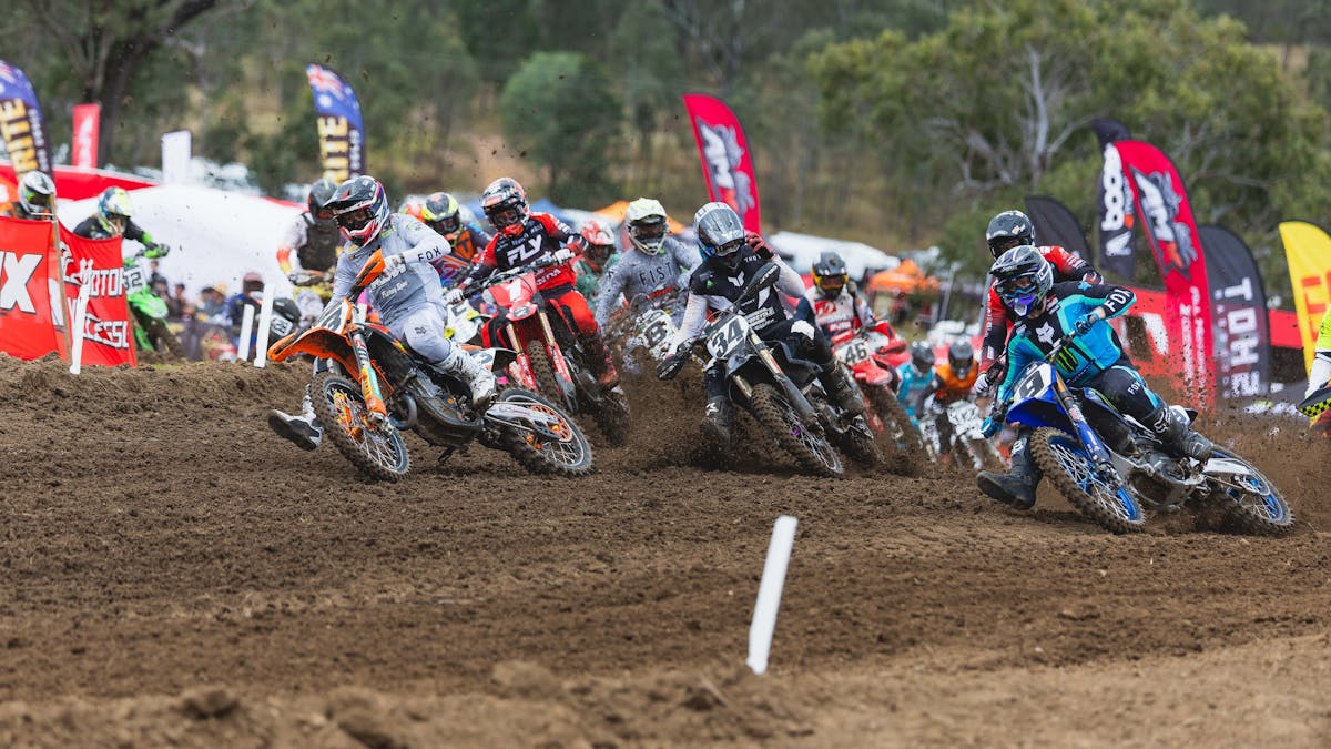 MX1 Category Riders hurtle through a corner