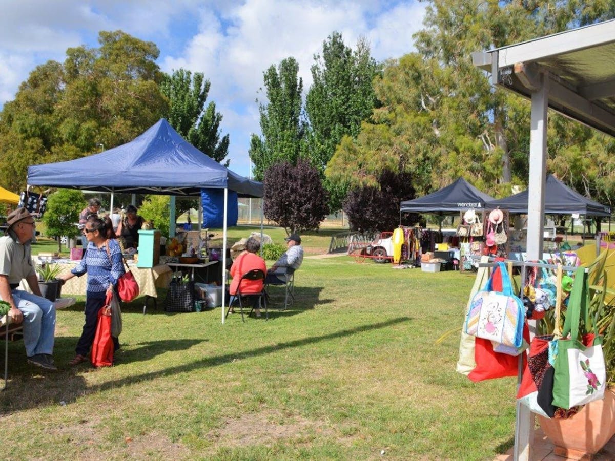 Market stalls on green grass