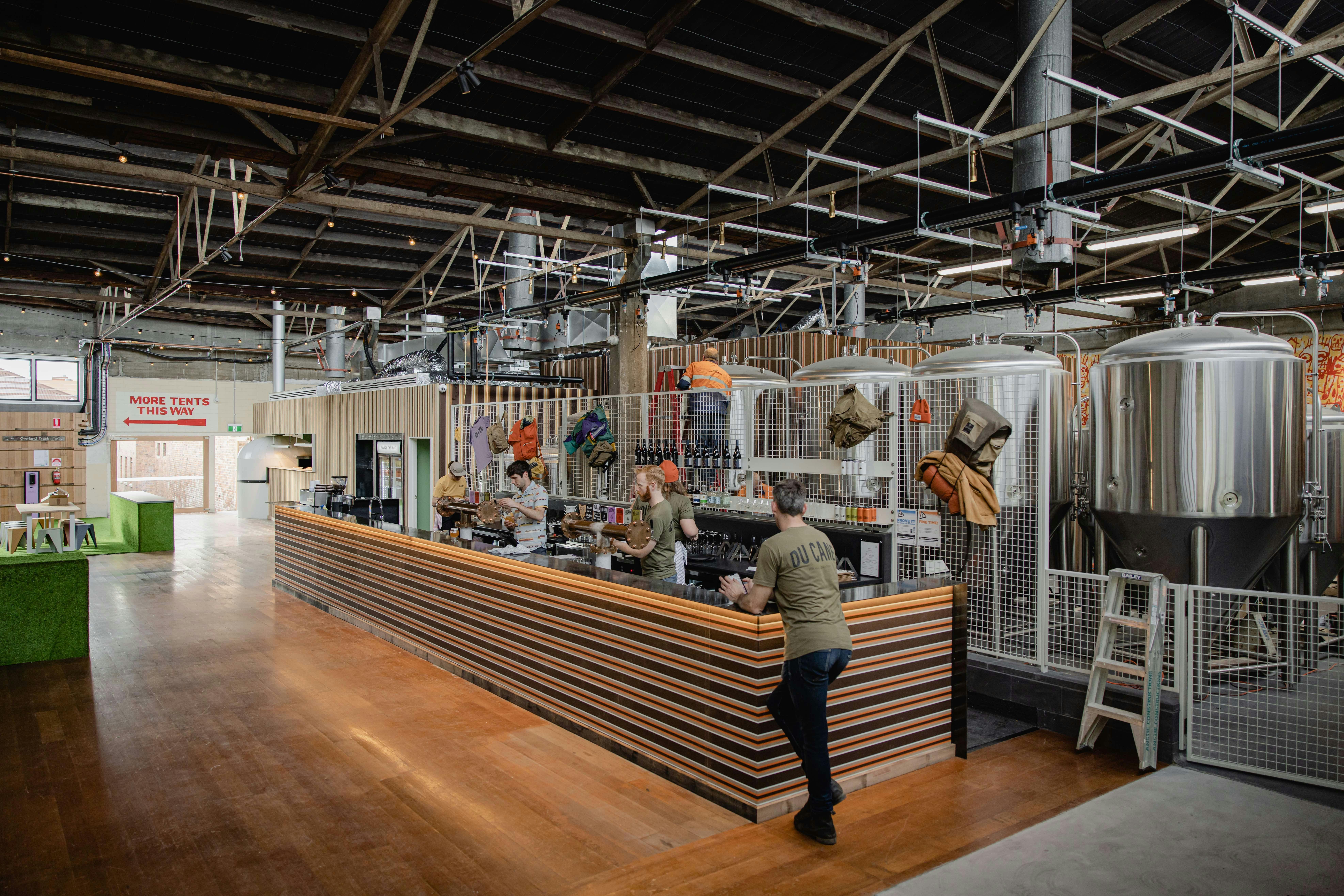 Person standing at the main bar before opening