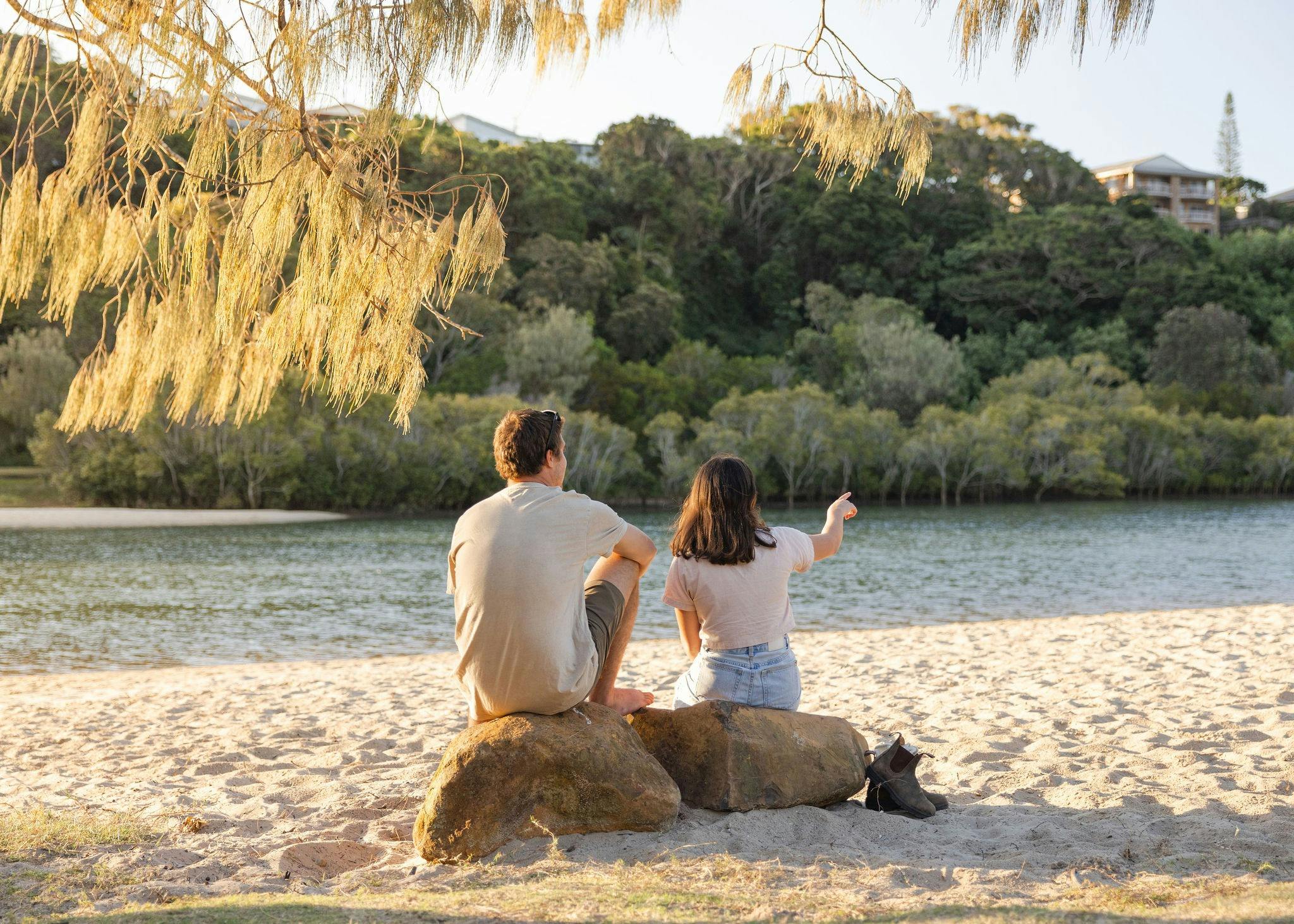 Couple sitting looking at Shaws Bay