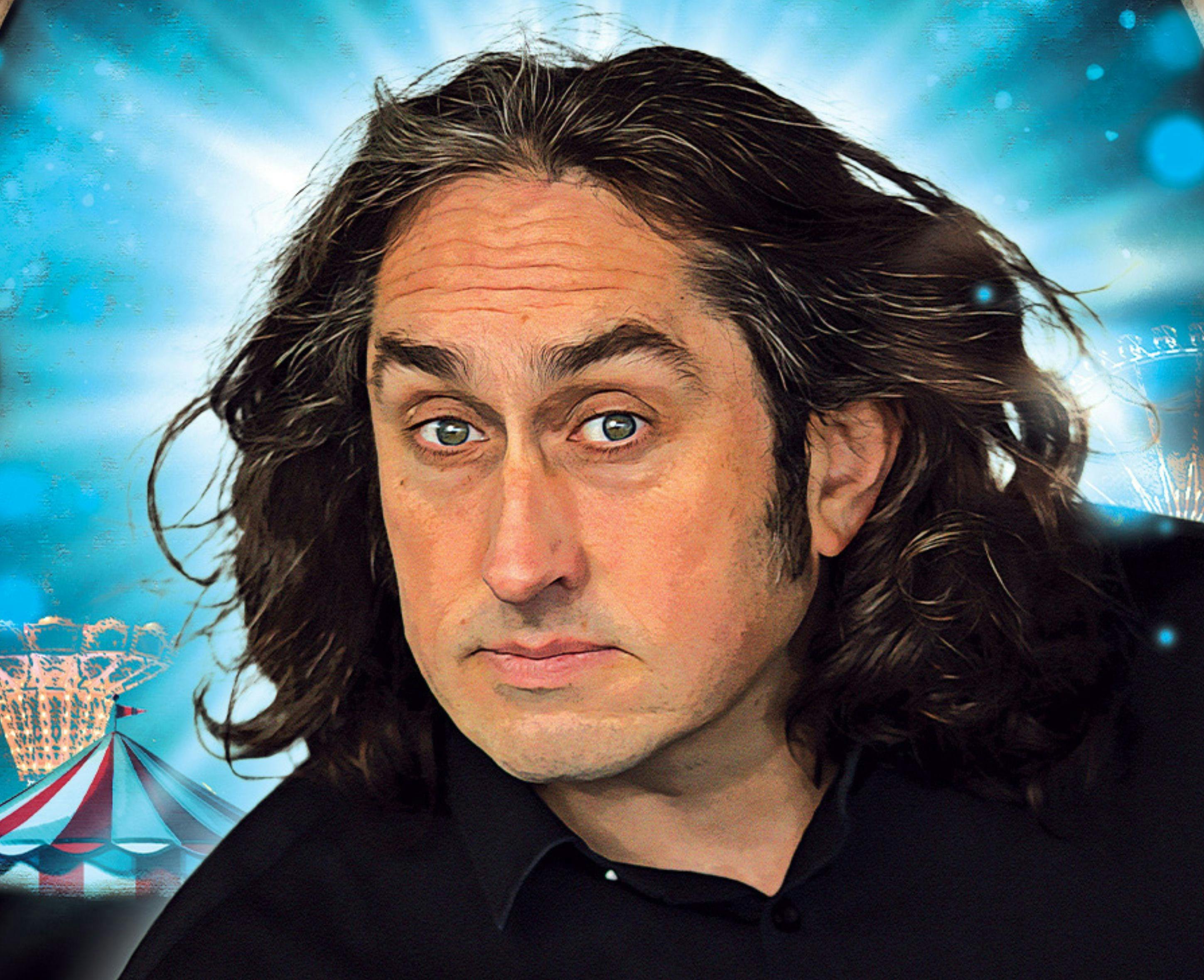 Ross Noble, a man with long dark hair.