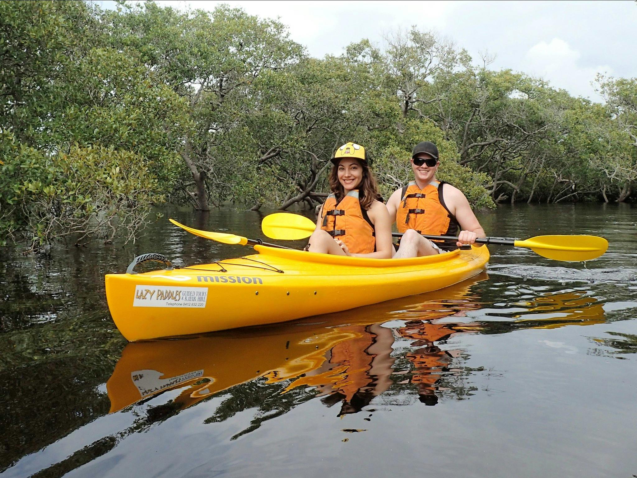 Couple enjoying the smooth waters of the Myall River by kayak