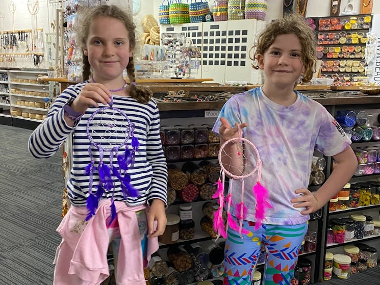 Making a dream catcher with beads feathers a web and hanger is very popular for a class