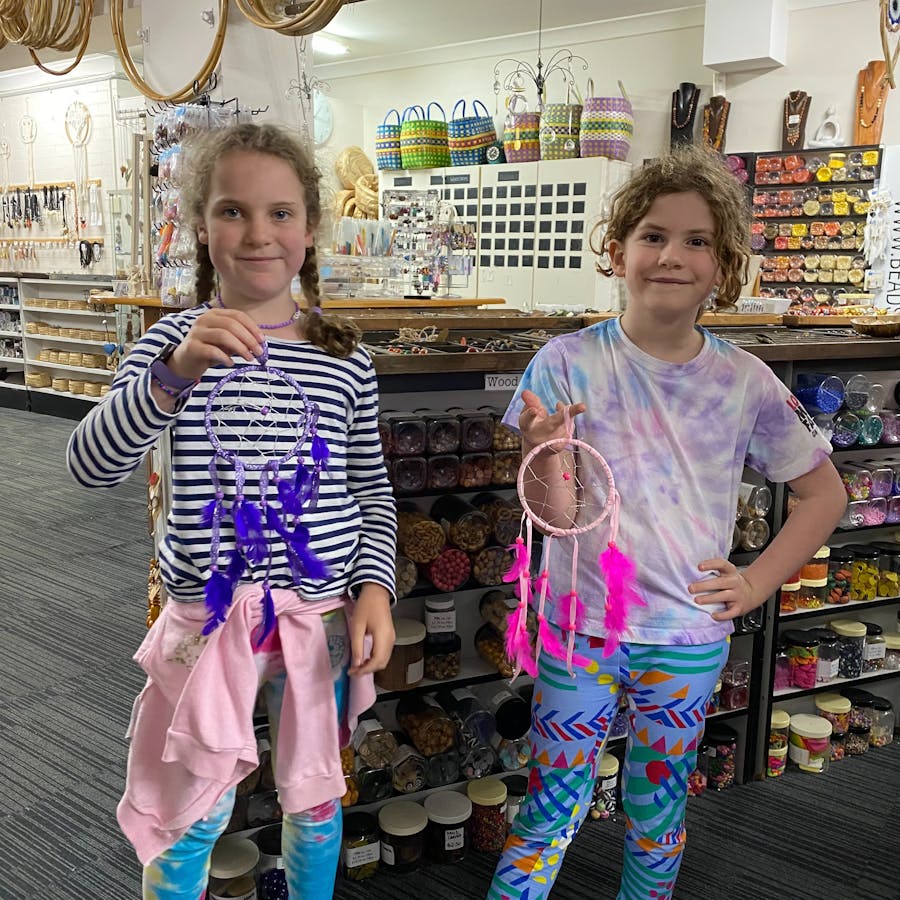 Making a dream catcher with beads feathers a web and hanger is very popular for a class