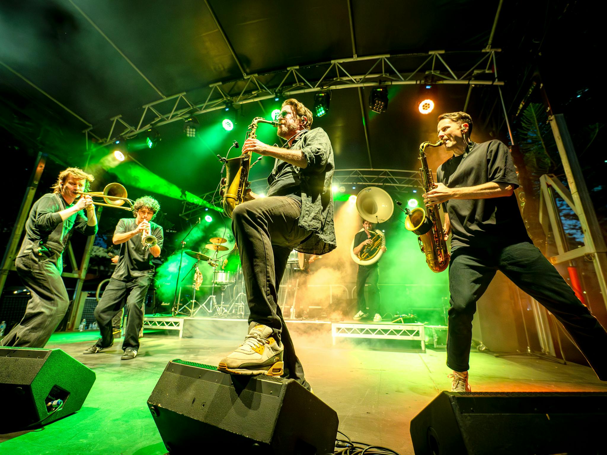Six musicians from Hot Potato Band are on the stage performing