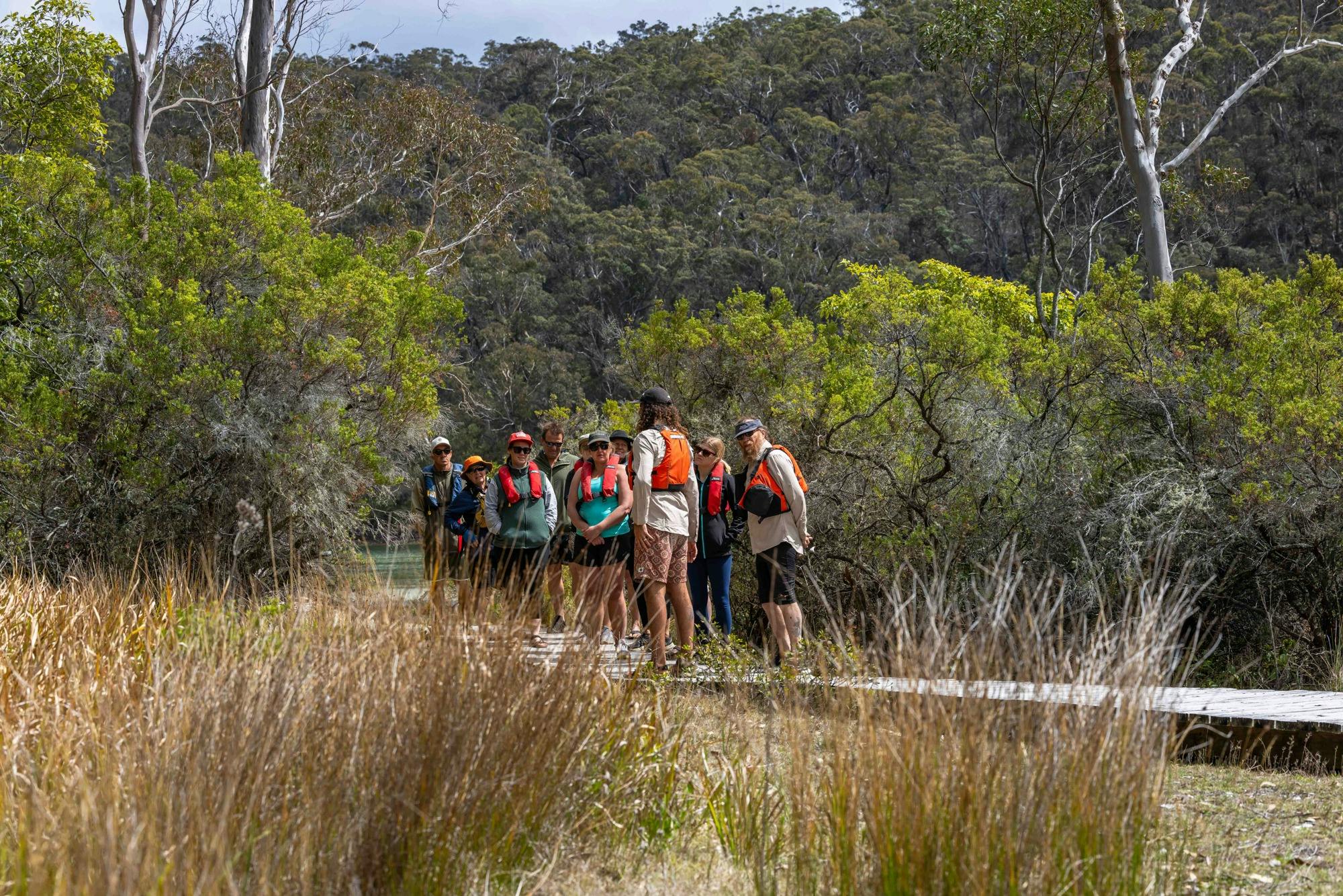 Guide and guests on pathway