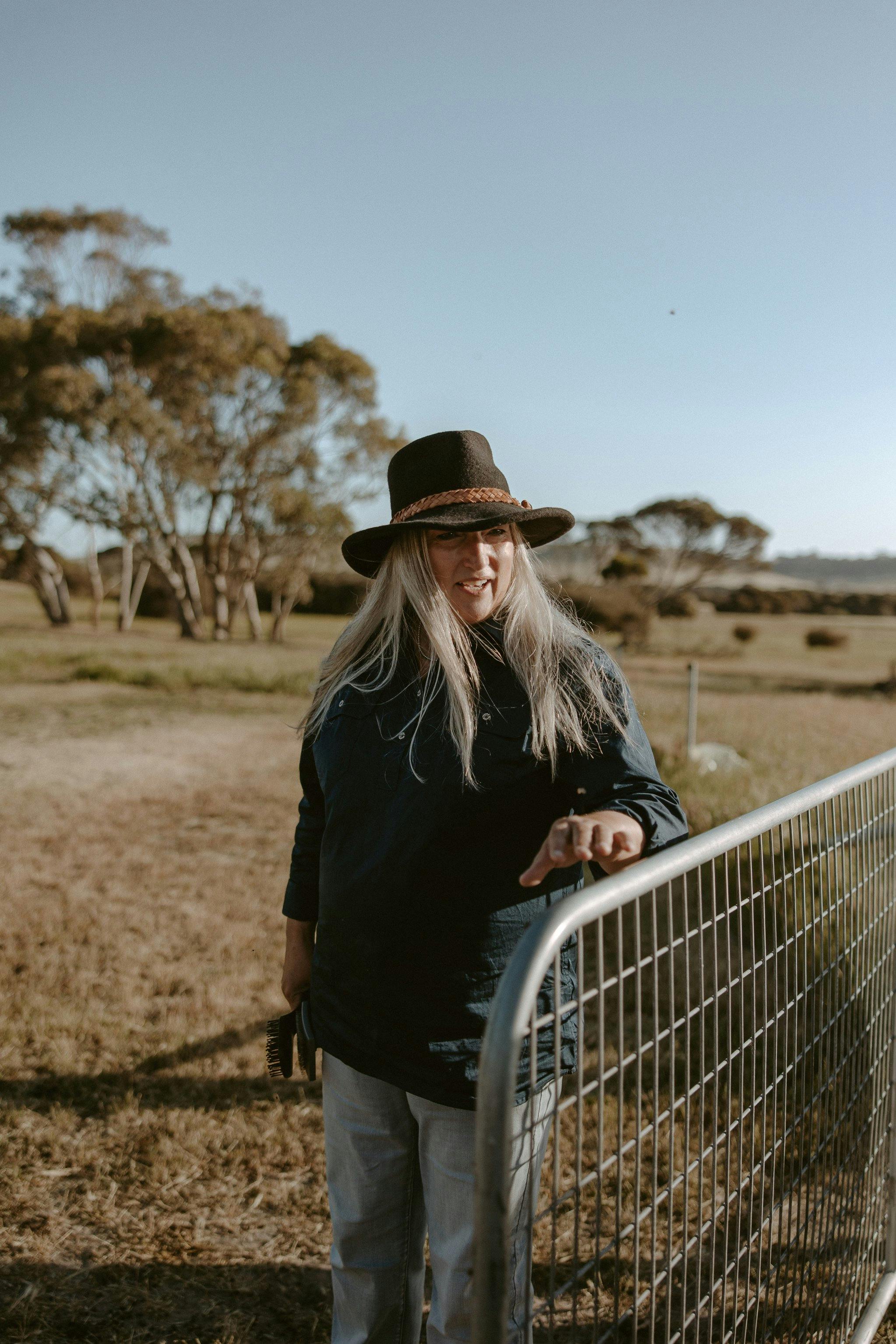 Elena your guide leads the way through a farm gate to the paddock