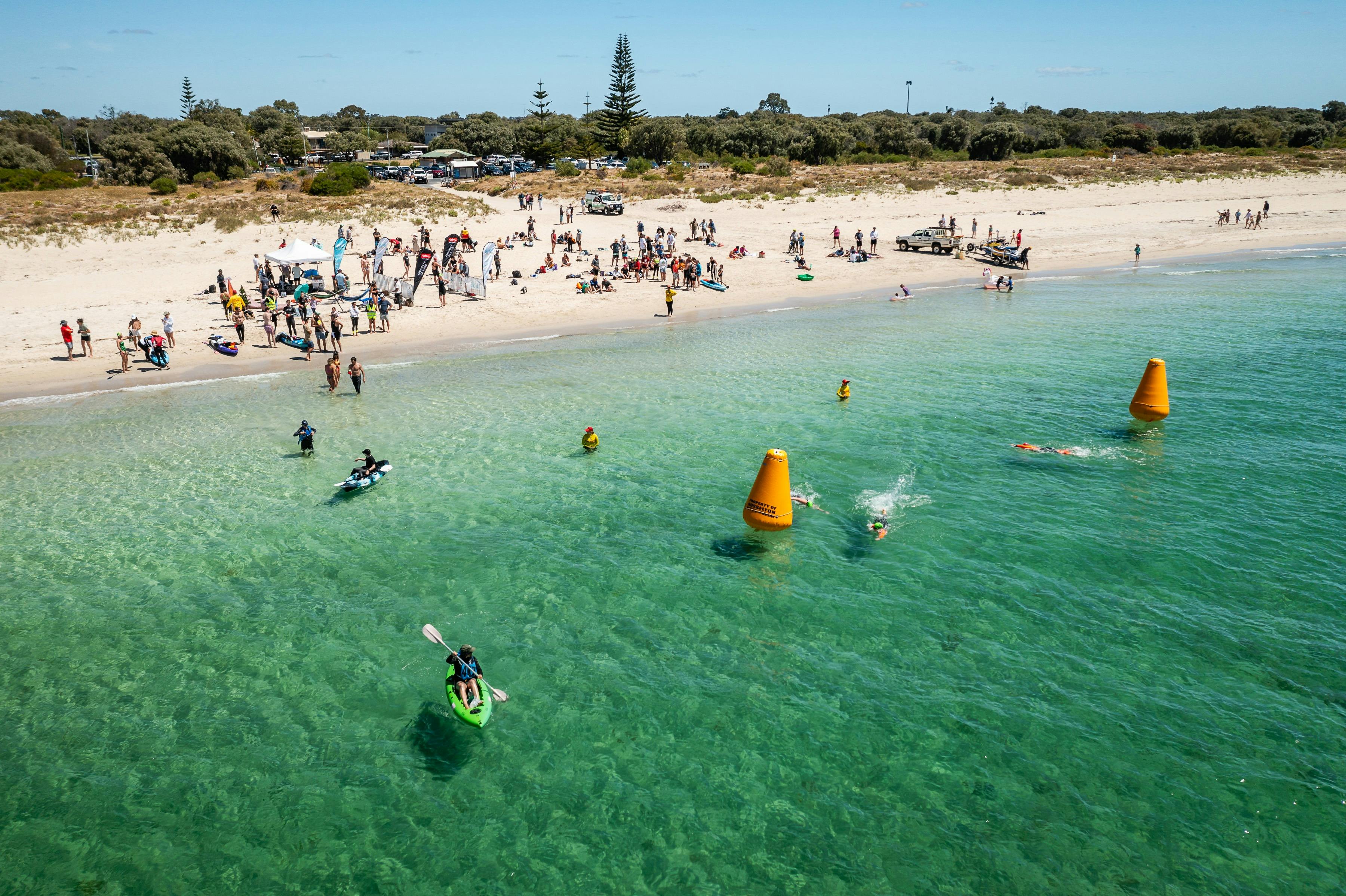 Spectators and supporters cheer on from the Beach Parties