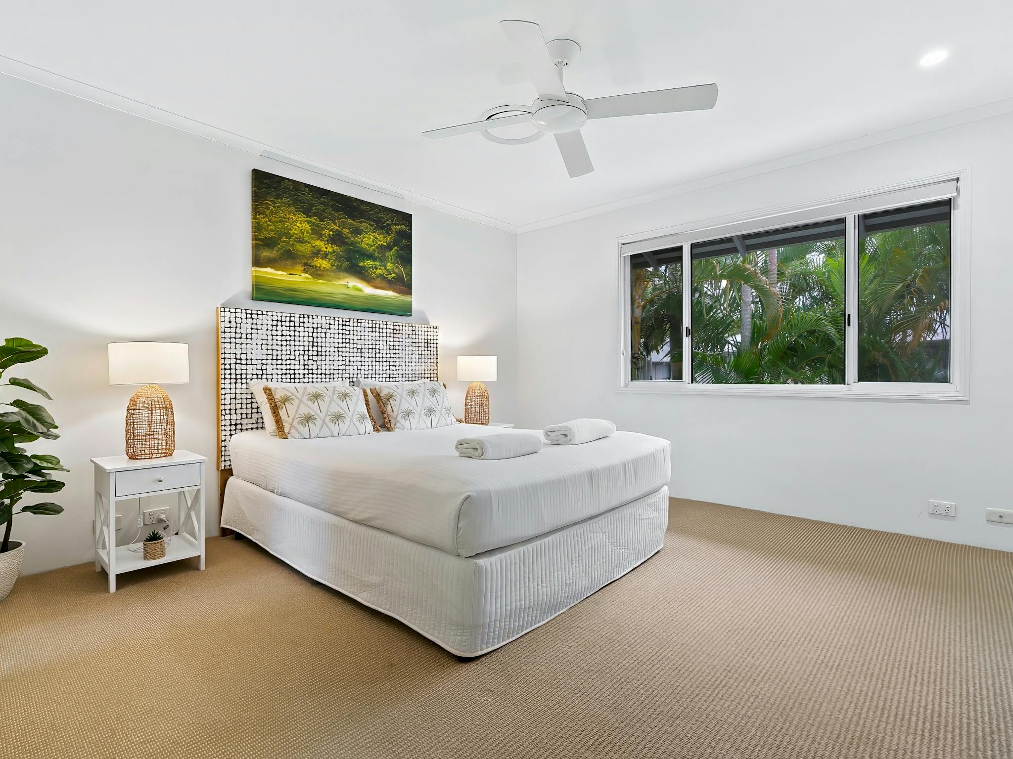 Bedroom with queen bed and bedside tables Bedroom with queen bed and bedside tables