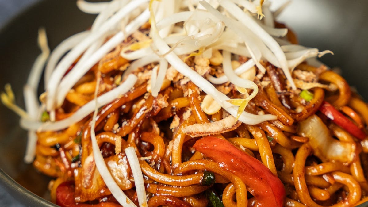 Bowl of sticky wok tossed noodles