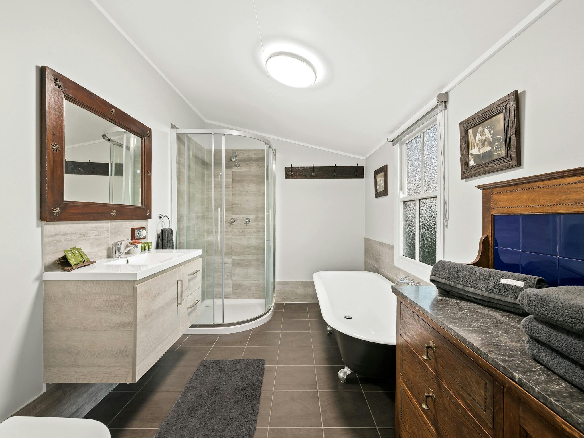 Mountview Homestead bathroom combines the new with the old with a shower and a claw foot bath.