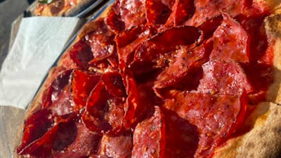 Salami and Vegan Pizza