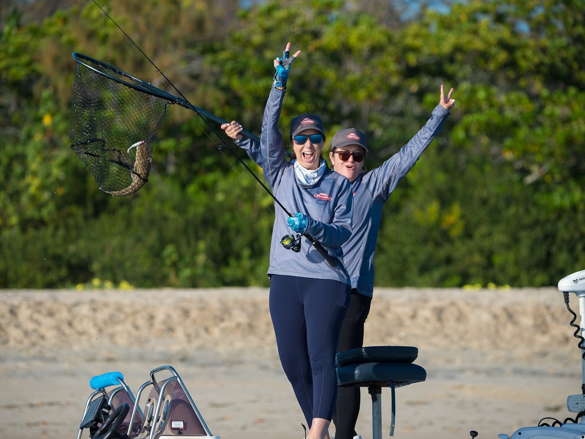Anglers smiling and celebrating during the Gold Coast Flathead Classic