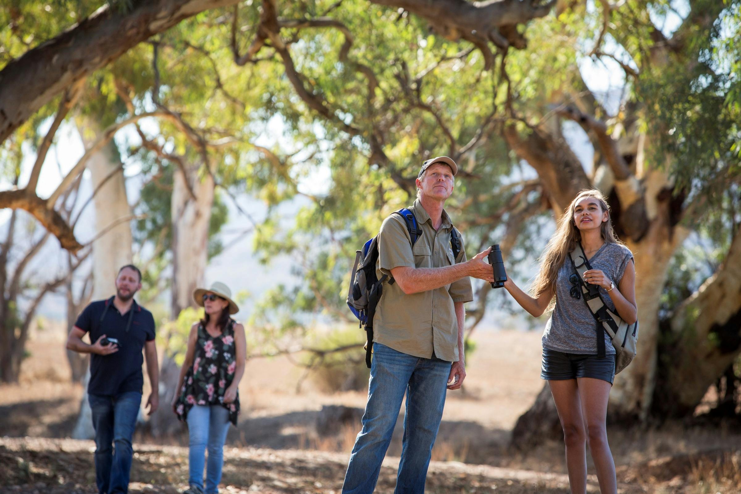 People discovering the unique flora and fauna on a guided walking trail