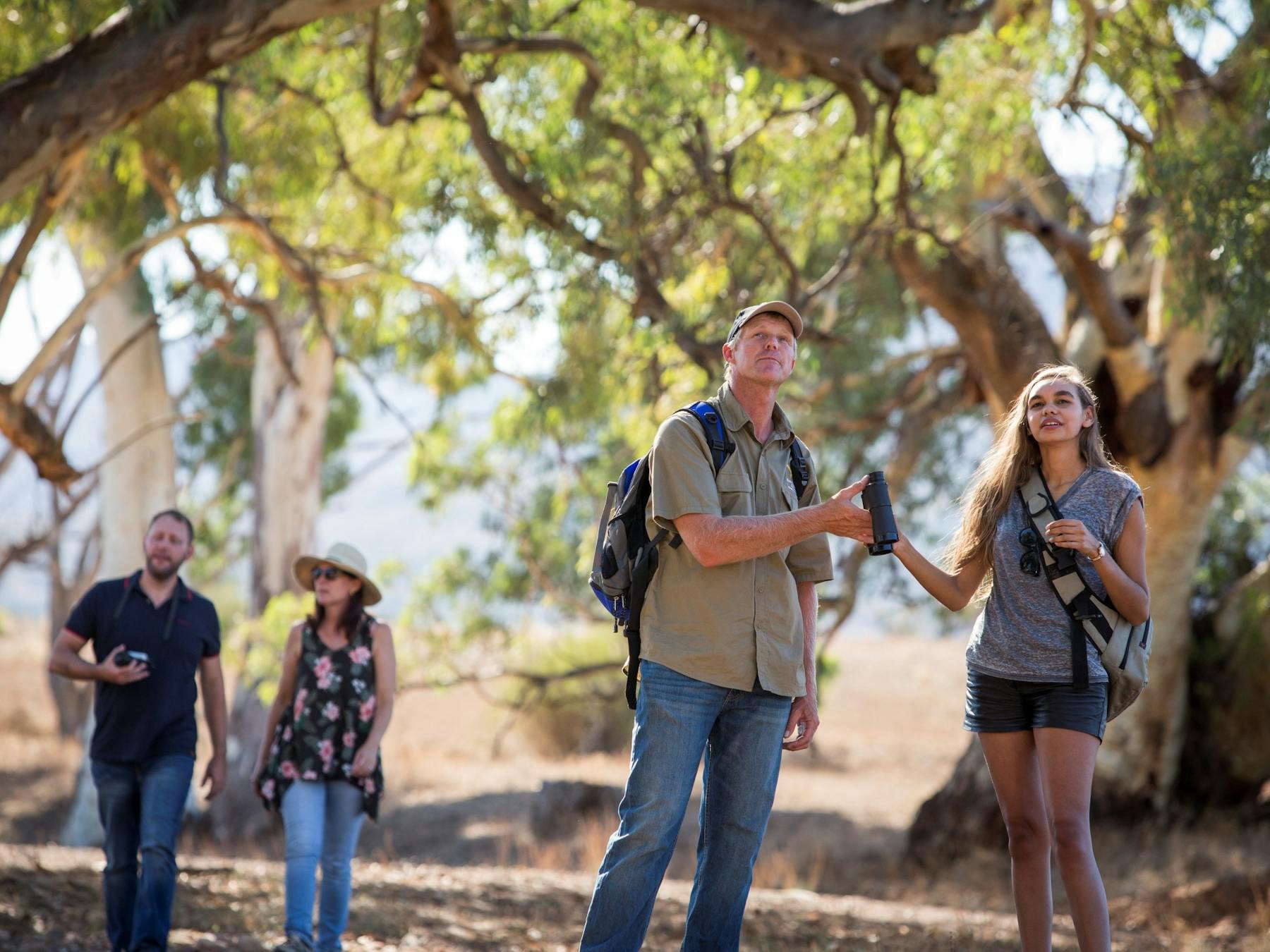 People discovering the unique flora and fauna on a guided walking trail