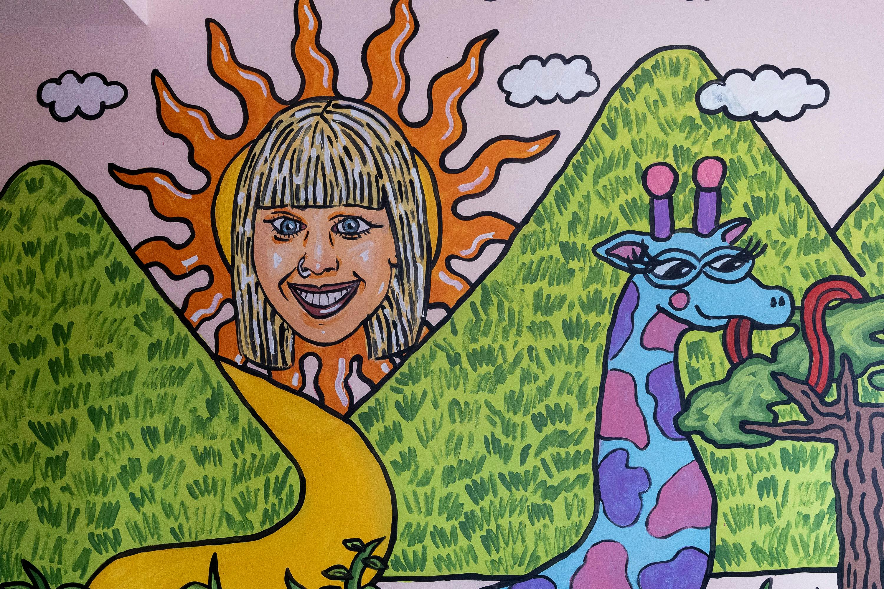 The brightly coloured mural shows Josie, whom the business is named for, emblazoned in the sun,
